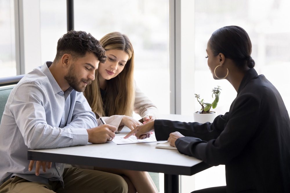 Citizenship by Investment Guide showing a couple completing their application with PassPro - Citizenship by Investment - PassPro banner Image